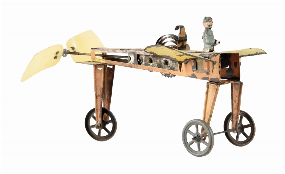 GERMAN TIN LITHO WIND-UP FLAPPING WING AIRPLANE.