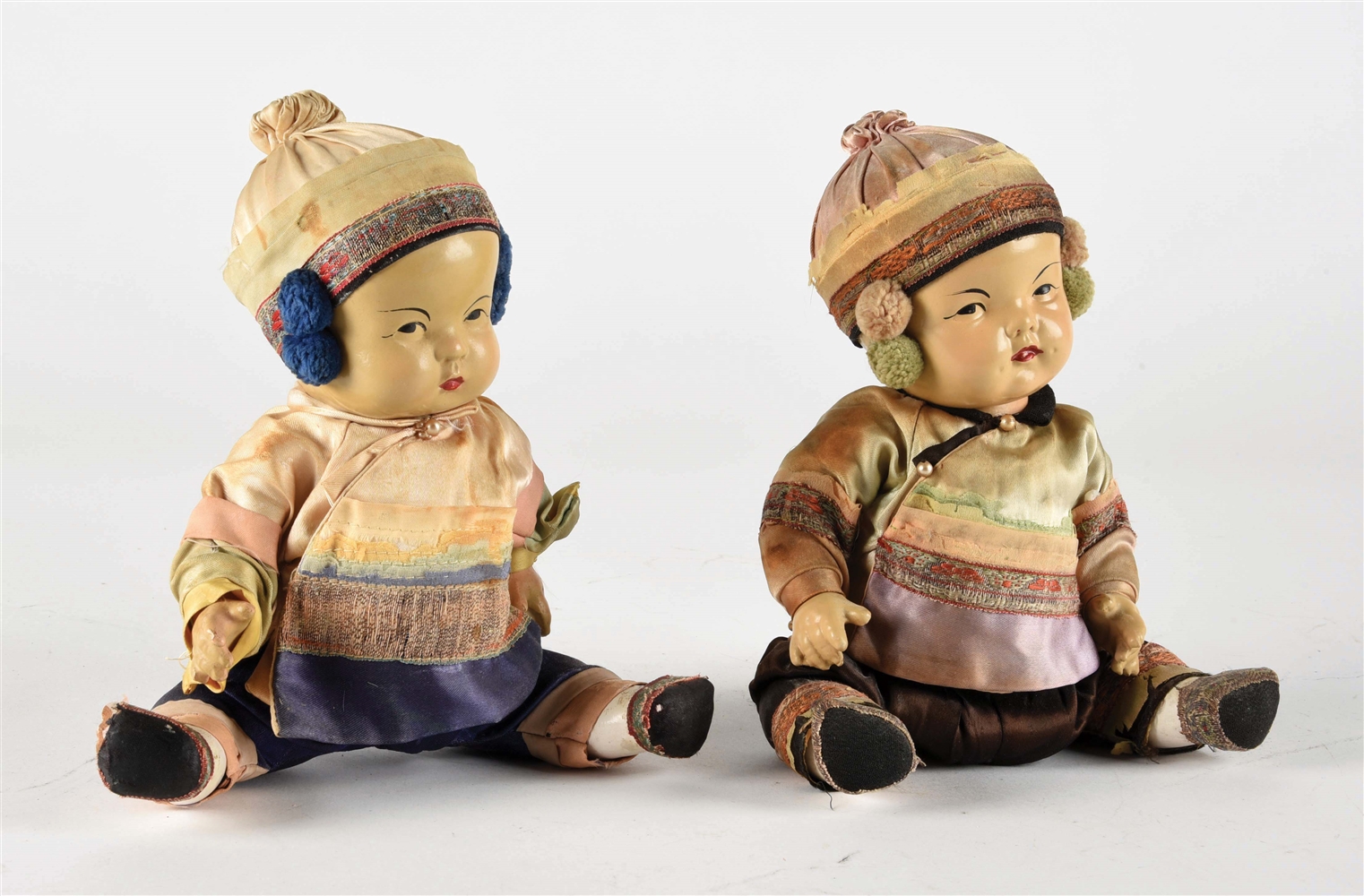 LOT OF 2: COMPOSITION BABIES PORTRAYING YOUNG ASIAN CHILDREN.