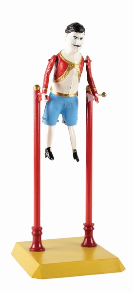 GERMAN TIN HAND-PAINTED WIND-UP GYMNAST TOY.