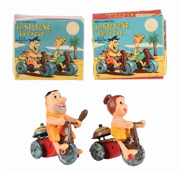 LOT OF 2: LINEMAR MARX WIND-UP CELLULOID AND TIN FLINTSTONE TRICYCLES.
