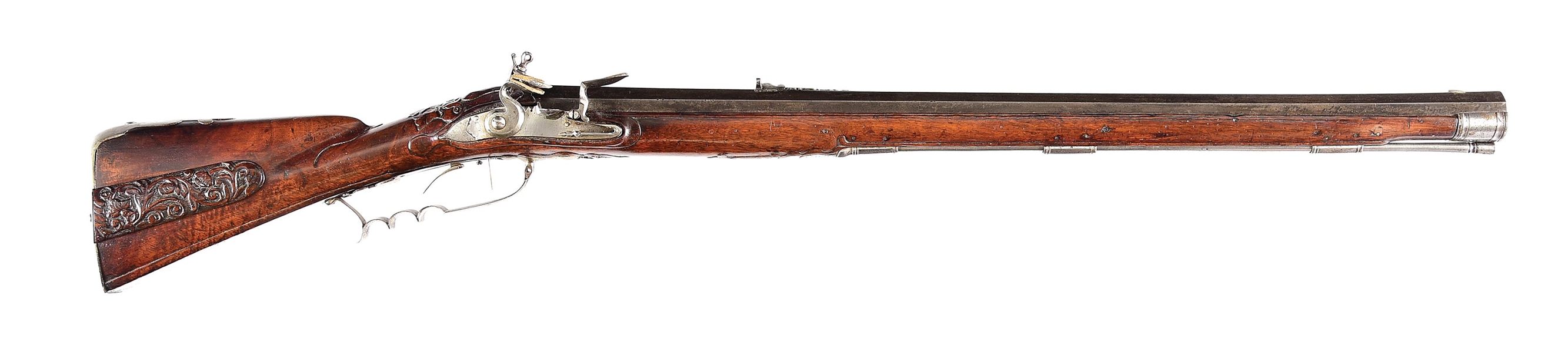 (A) A HIGHLY DECORATED AND GARGANTUAN JAEGER RIFLE SIGNED AND DATED 1727, PROBABLY USED AS AN EARLY MATCH RIFLE.