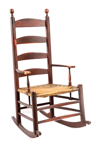 EARLY LADDER BACK ROCKING CHAIR WITH DEERSKIN SEAT. 
