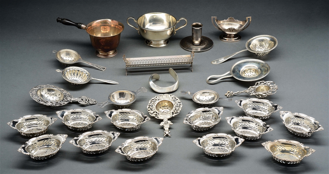 A GROUP OF SILVER TEA STRAINERS. 