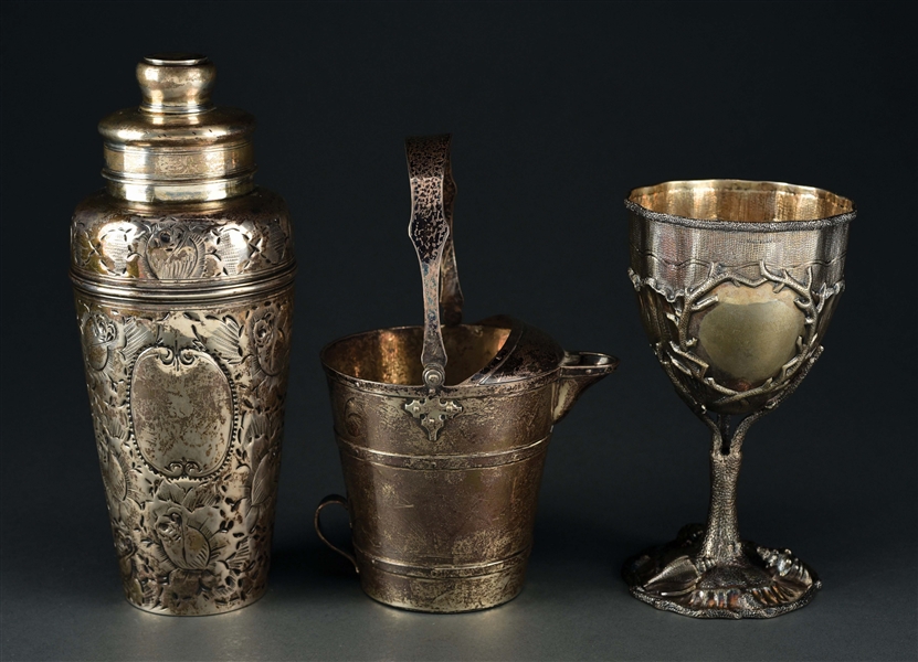 AN AMERICAN STERLING COCKTAIL SHAKER AND A GOBLET.