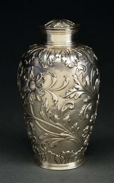AN ENGLISH SILVER COVERED JAR. 