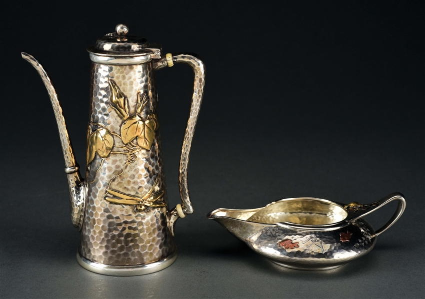 A TIFFANY STERLING COFFEE POT AND A CREAM JUG.