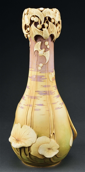 AMPHORA BERRY BAT VASE WITH APPLIED BATS AND RETICULATED CARVED BAT TOP WITH PASTEL SKY AT SUNSET BACKGROUND.