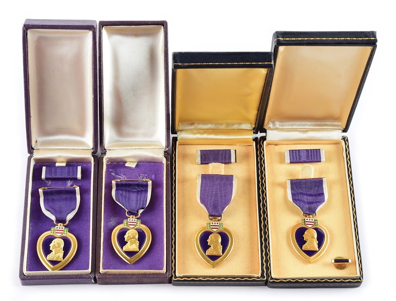 LOT OF 4: TWO TYPE I PURPLE HEART MEDALS IN EARLY BOXES AND TWO US NAVY/MARINE TYPE 2 PURPLE HEART MEDALS IN SHORT COFFIN BOXES