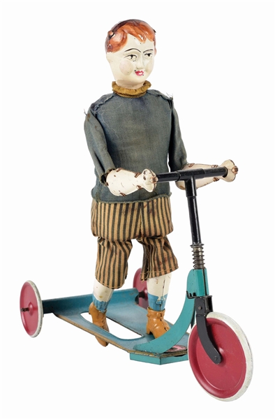PRE-WAR FRENCH HAND-PAINTED TIN BOY ON SCOOTER TOY.