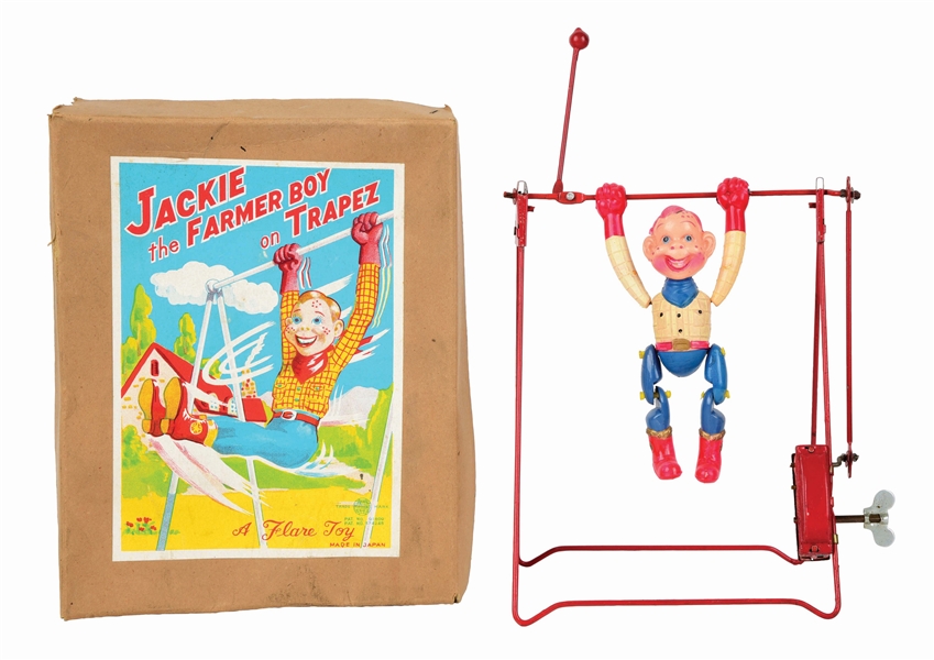 JAPANESE CELLULOID JACKIE THE FARMER BOY ON TRAPEZE TOY.