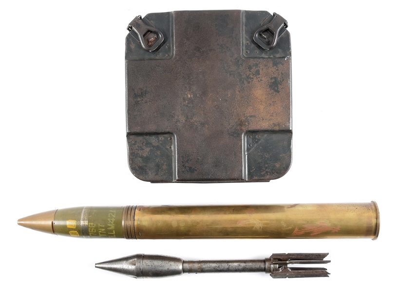 LOT OF 3: WWII M42A1 76MM TRAINING ROUND, INERT BAZOOKA ROCKET, AND GERMAN WORLD WAR II DUMMY TELLER MINE WITH TRANSIT CASE.