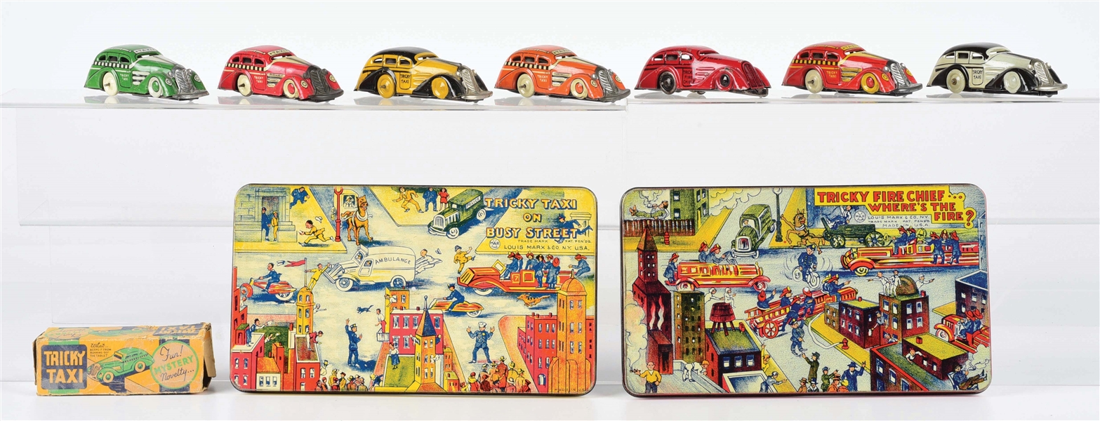 LOT OF 9: TRICKY TAXI CARS AND TINS.