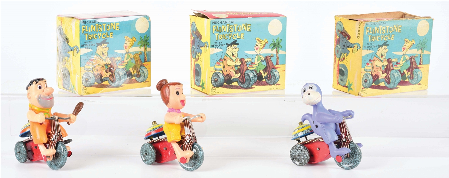 LOT OF 3: LINEMAR WIND-UP CELLULOID AND TIN LITHO FLINTSTONE TRICYCLE TOYS.