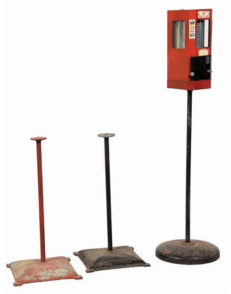 LOT OF 3: CAST-IRON VENDING MACHINE STANDS AND A SELECT-A-VEND VENDING MACHINE.