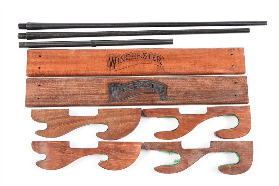 LOT OF 5: WINCHESTER MODEL 42 BARRELS AND MAGAZINE TUBE WITH WOODEN GUN RACKS.