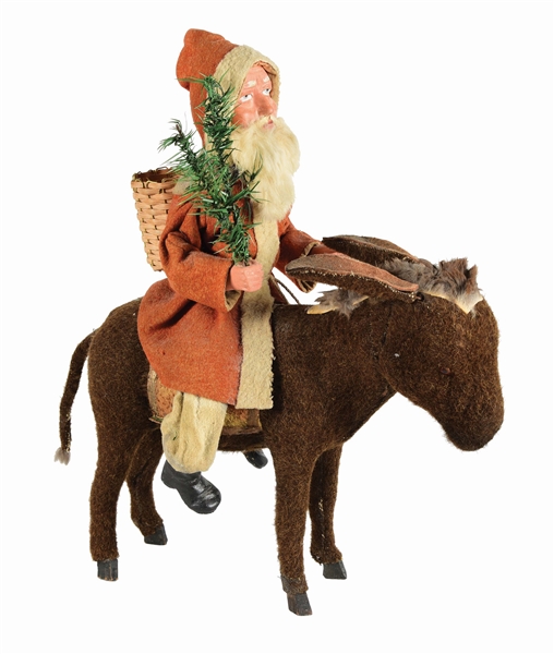 MECHANICAL WIND-UP COMPOSITION SANTA ON CLOTH-COVERED DONKEY.