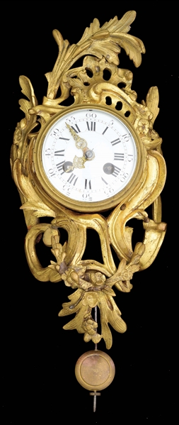 SMALL FRENCH GILT WALL CLOCK.