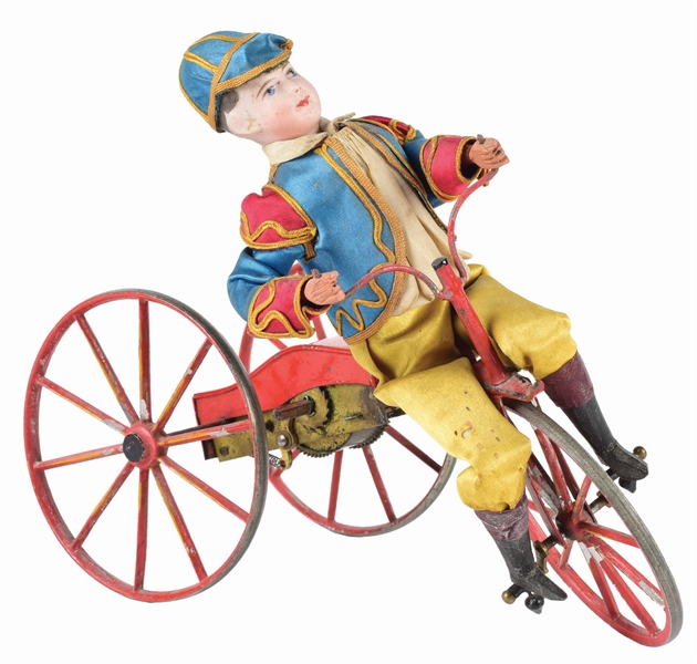 EARLY EUROPEAN BISQUE DOLL RIDING VELOCIPEDE CLOCKWORK TOY.