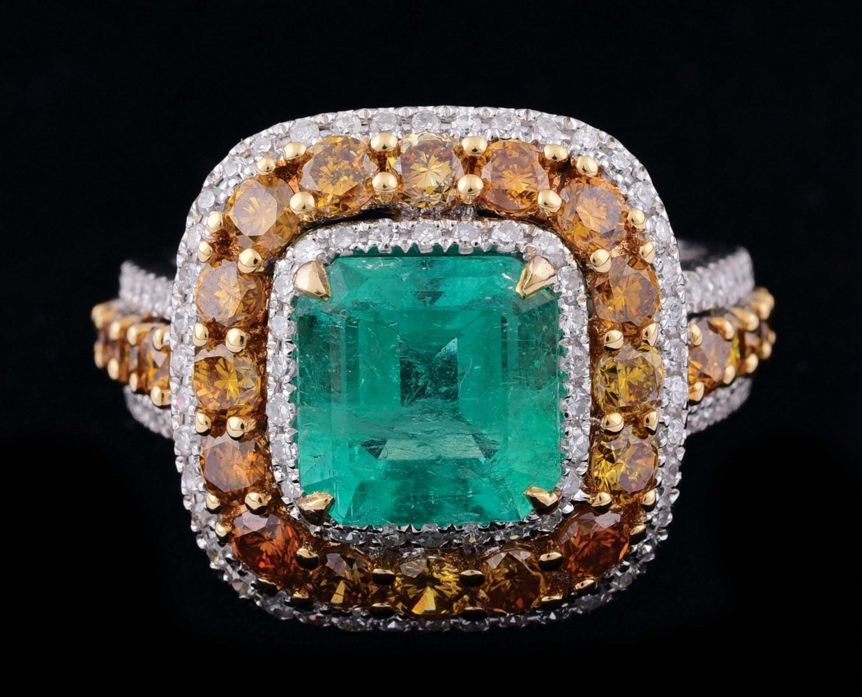 LADIES 18K WHITE GOLD EMERALD AND MIXED COLOR DIAMOND RING.