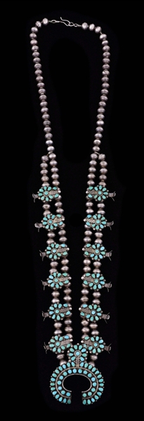 VINTAGE ZUNI STERLING SILVER AND TURQUOISE PETIT POINT SQUASH BLOSSOM NECKLACE.