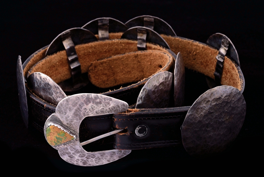 JAN LOCO, WARM SPRINGS APACHE, HAMMERED STERLING SILVER CONCHO AND LEATHER BELT.