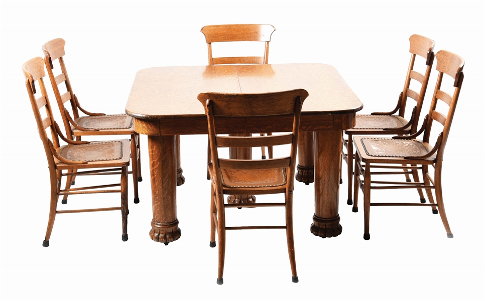 LOT OF 7: QUARTERED OAK TABLE AND 6 LEATHER SEAT MATCHING CHAIRS.