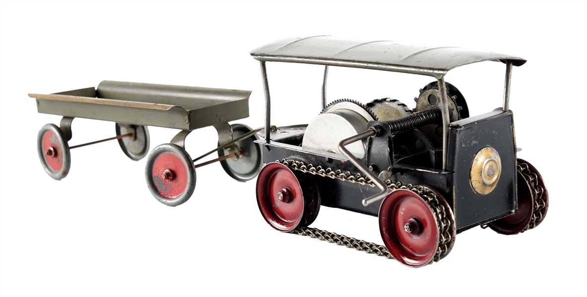 EARLY SCARCE WILKINS PRESSED STEEL WIND-UP TRACTOR PULLING TRAILER.