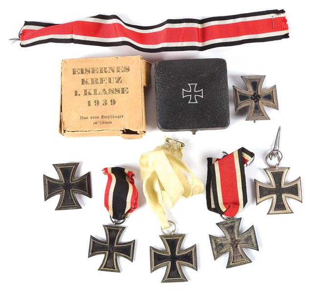 LOT OF 7: WWII IRON CROSSES INCLUDING A CASED AND BOXED EXAMPLE.