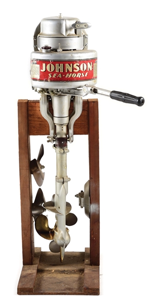 JOHNSON SEA HORSE OUTBOARD MOTOR WITH EXTRA PARTS AND STAND.