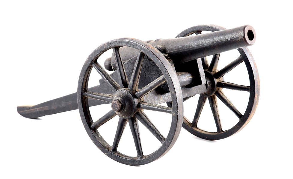 CAST IRON SCALE MODEL CANNON ON CAST IRON CARRIAGE.