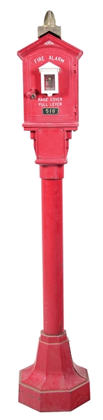 HORNI CAST IRON FIRE ALARM BOX MOUNTED ON IRON PEDESTAL BASE. 