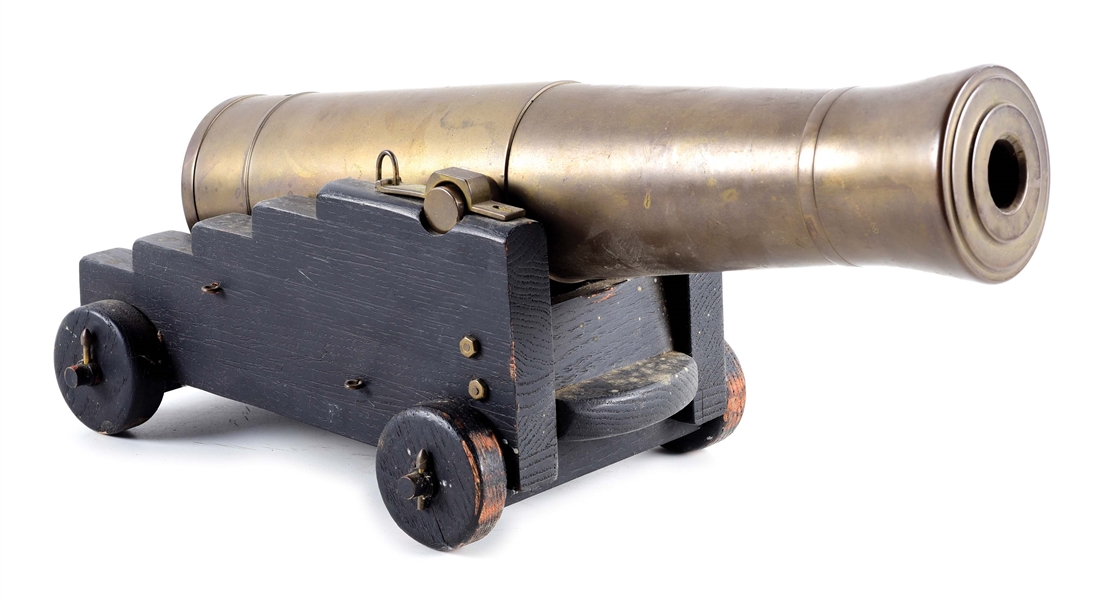 UNMARKED BRASS CANNON WITH NAVAL STYLE CARRIAGE.