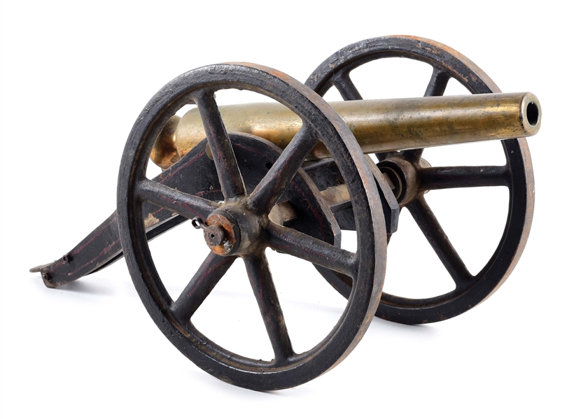 SMALL BRASS CANNON WITH CAST IRON CARRIAGE.