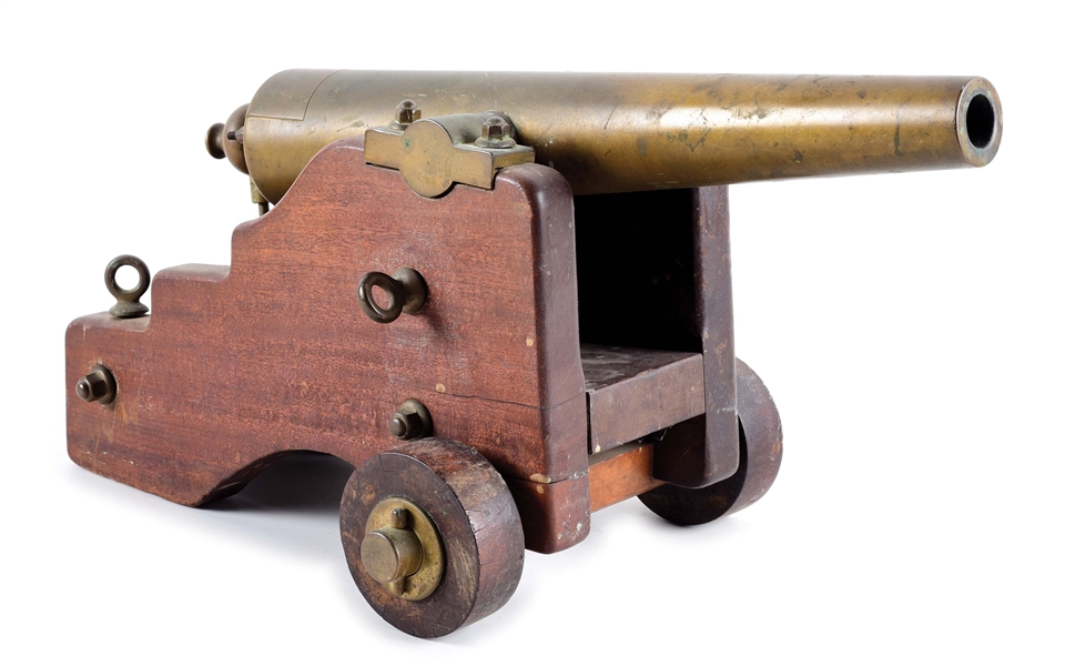 STRONG FIRE ARMS CO. BRASS CANNON WITH NAVAL CARRIAGE.