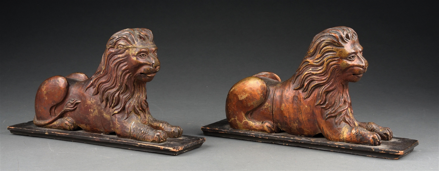PAIR OF EARLY CARVED AND GILDED WOODEN LIONS.