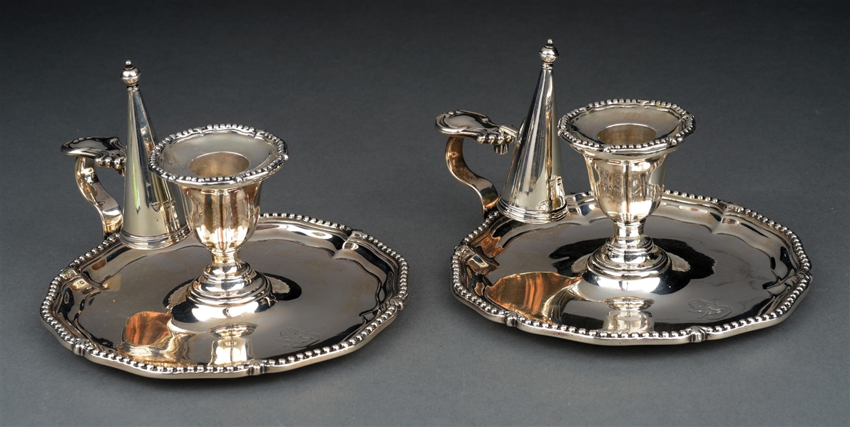 A PAIR OF ENGLISH SILVER CHAMBERSTICKS. 