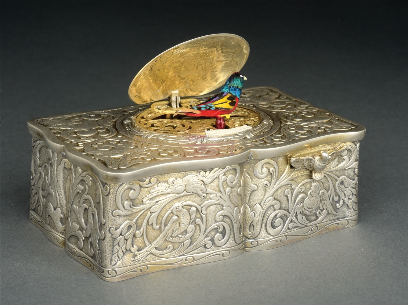 STERLING SILVER REPOUSSE SINGING BIRD AUTOMATON WITH ORIGINAL BOX.