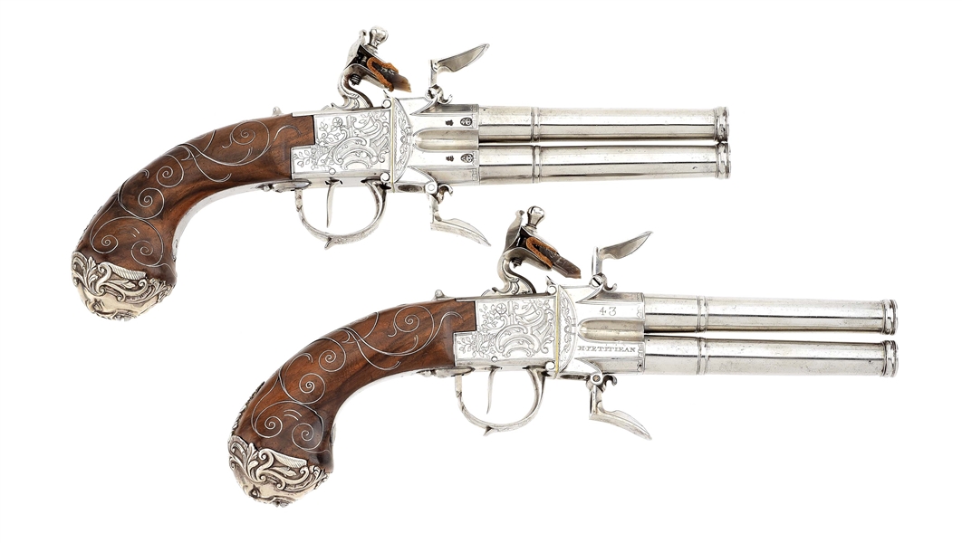 (A) FINE AND SCARCE PAIR OF BRITISH SILVER MOUNTED RIFLED SWIVEL BREECH FLINTLOCK PISTOLS BY H. PETITJEAN.