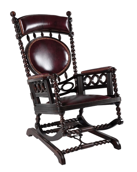 CARVED LEATHER ROCKING CHAIR.