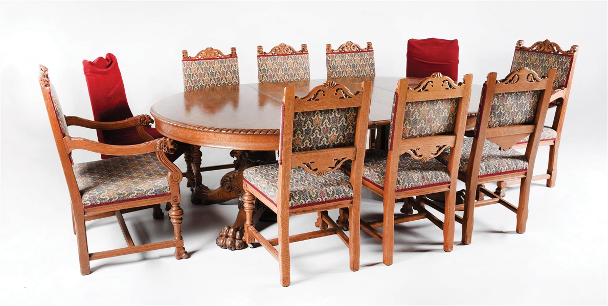 CLAW FOOT DINING TABLE W/ 10 CHAIRS AND 5 EXTENSION LEAVES.