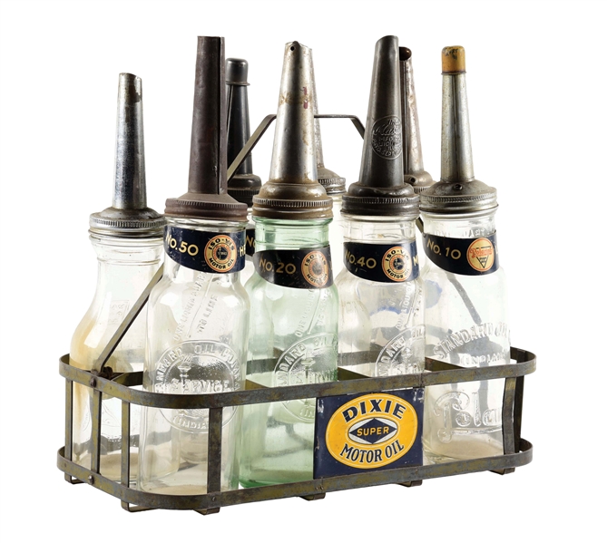 SET OF EIGHT STANDARD MOTOR OIL GLASS OIL BOTTLES WITH DIXIE MOTOR OIL METAL RACKING. 