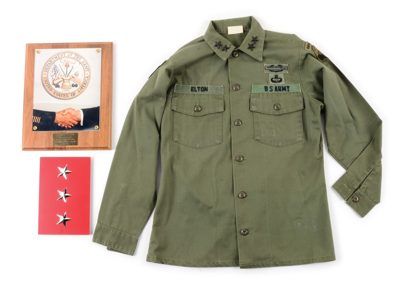 US COLD WAR LT. GENERAL ROBERT M. ELTON FATIGUE JACKET, LICENSE PLATE, AND PLAQUE GROUPING.