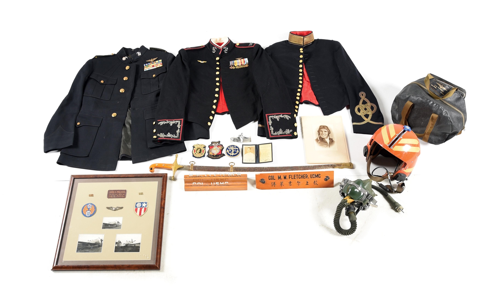 SIZEABLE AND IMPRESSIVE USMC UNIFORM, HELMET, INSIGNIA, SWORD, PHOTO, AND PAPER GROUPING OF COL. MAURICE W. FLETCHER.