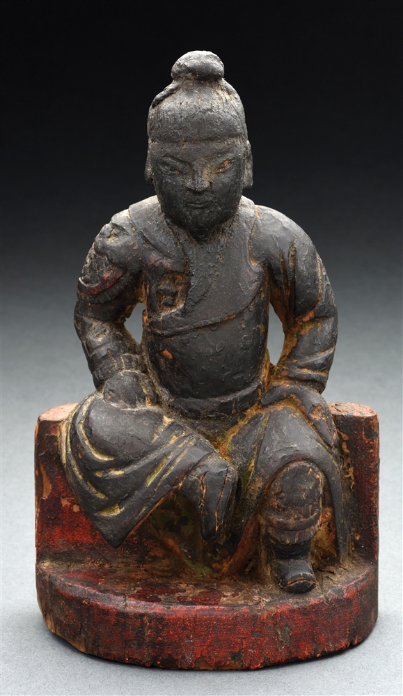 ASIAN WOOD CARVING OF SEATED WARRIOR.