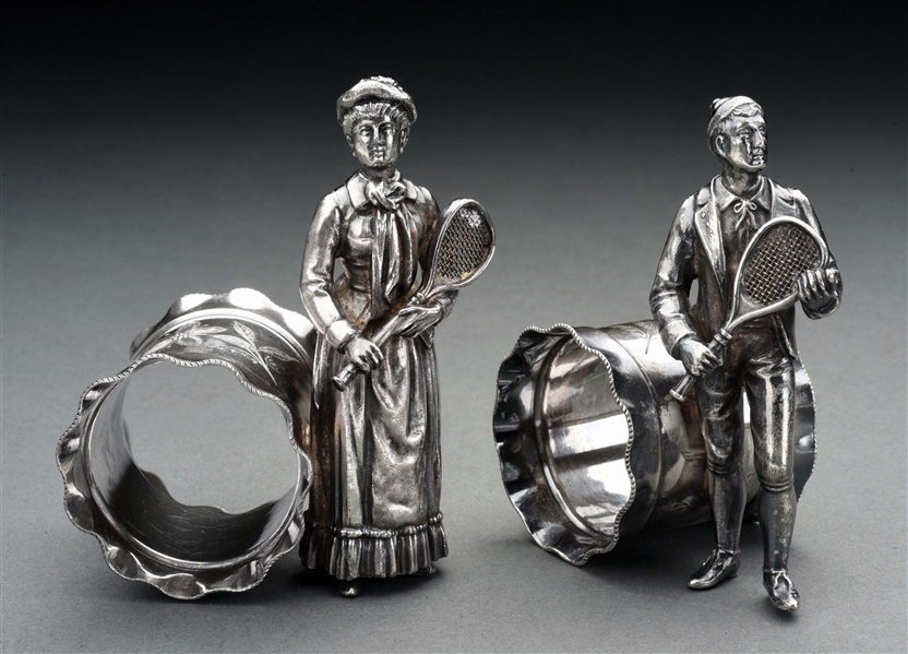 LOT OF 2: MATCHED PAIR OF FIGURAL TENNIS PLAYERS NAPKIN RINGS.