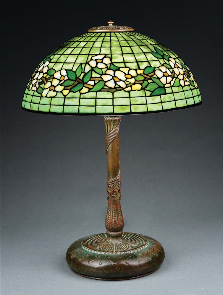 TIFFANY STUDIOS BELTED DOGWOOD LEADED GLASS TABLE LAMP.