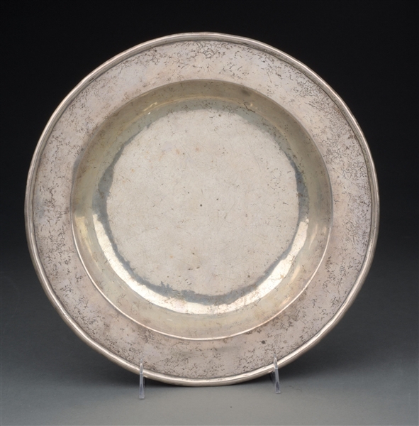 A SILVER CHARGER OR SHALLOW DISH. 