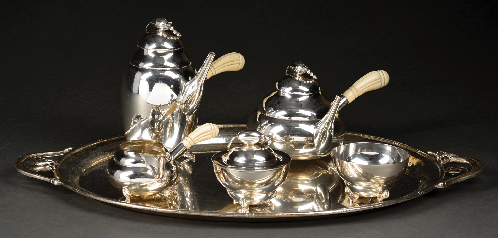 A FIVE PIECE STERLING TEA AND COFFEE SERVICE. 