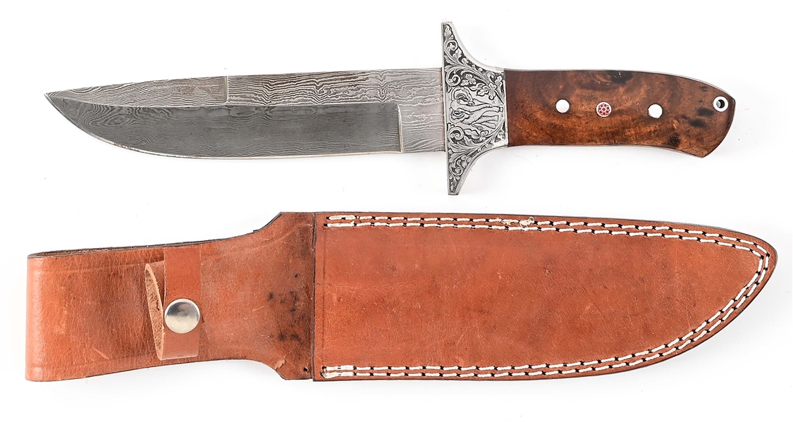 IMITATION DAMASCUS DROP POINT KNIFE WITH ORNATE GUARD.