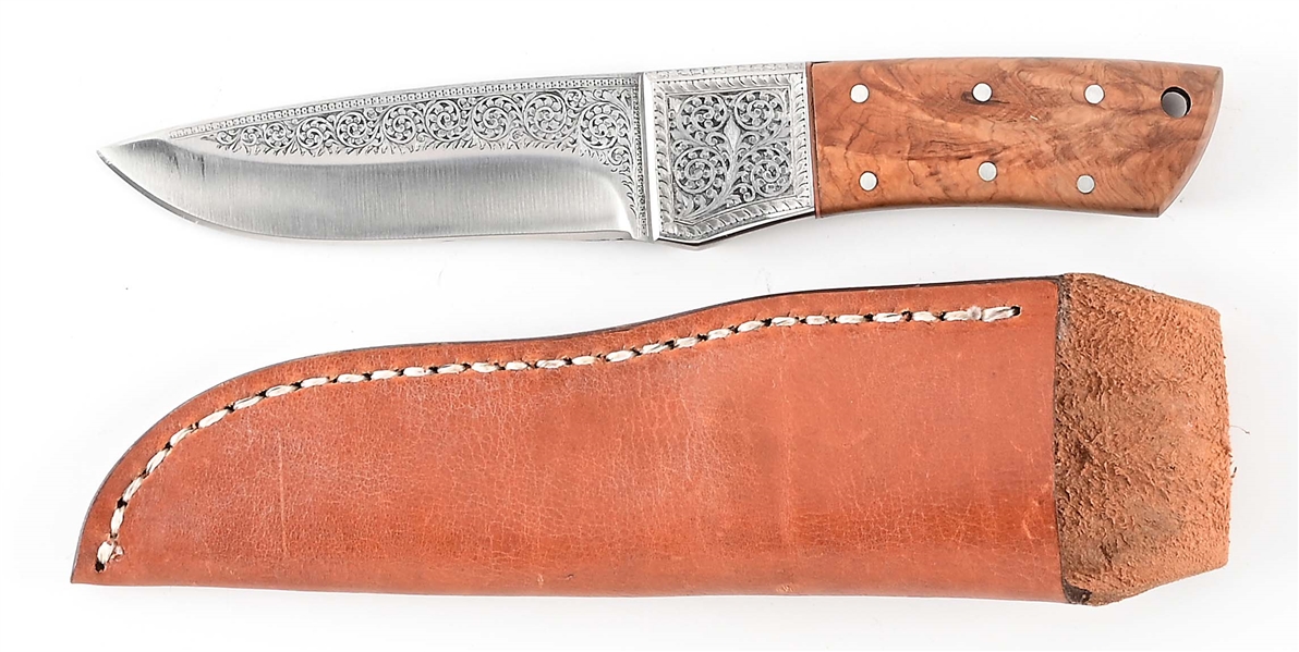 DROP POINT KNIFE WITH ORNATE DESIGNS.